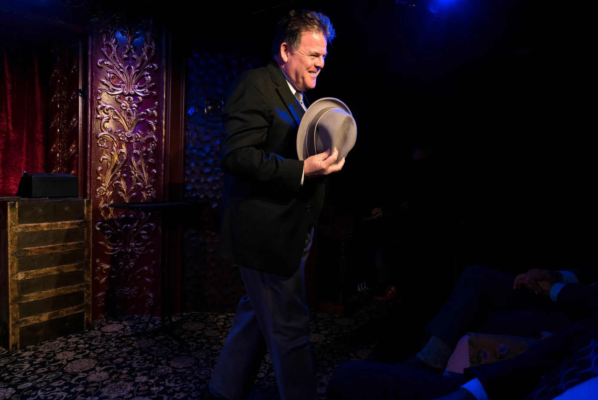 John Carney onstage with hat